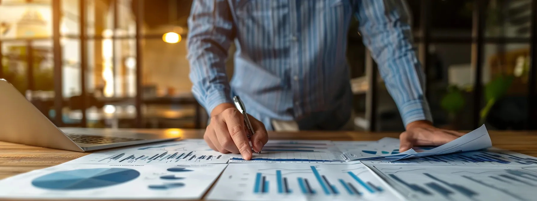 a sophisticated office setting in cincinnati features a focused financial advisor engaged in a dynamic discussion with clients, with detailed charts and reports showcasing personalized wealth management strategies and investment plans prominently displayed on a sleek conference table under warm, professional lighting.